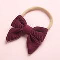 Detailed view of dark red corduroy bow with highly elastic soft nylon baby headband - Wine Red (17)