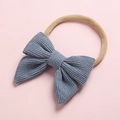 Detailed view of baby headband with a blue corduroy bow on a soft nylon elastic band - Light Blue (19)