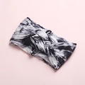 Detail of baby headband featuring black and white tie-dye soft knit fabric and knot design - Black Gray Tie-Dye (7)
