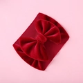 Detail view of burgundy velvet bow and ribbed fabric texture on baby headband - Burgundy