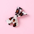 Close-up detail of leopard print velvet bow hair clip with rich fabric texture - Vintage Brown Black Leopard