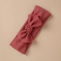 Detail of brick red ribbed knit baby headband with a large decorative bow tie - Brick Red Style (9)