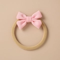Detail of baby headband with a pink knitted bow and soft nylon elastic band for infants - Pink Seamless Knit Bow (8)