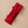 Close-up of a wide red elastic headband with a large bow in soft knitted fabric - Red Style (12)