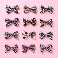 Set of 12 multi-color leopard print velvet bow hair clips for girls on pink background - Random Color