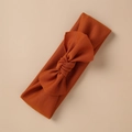 Detail of caramel knit baby headband featuring a soft ribbed texture and large bow - Caramel Style (14)