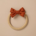 Close-up of caramel ribbed knit bow on elastic beige baby headband accessory - Caramel Ribbed Knit Bow (13)