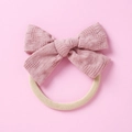 Detalle de diadema para bebé con lazo rosa empolvado en tela de cuadros y banda suave - Rosa Oscuro