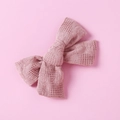 Detailed close-up of pink cotton plaid bow hair clip with textured waffle fabric detail - Dusty Pink