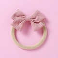 Close-up of pink jacquard fabric bow on a soft elastic nylon headband for babies - Pinkish Brown