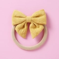 Detail of yellow hollow mesh bow headband with soft elastic nylon band for baby girls - Yellow