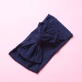 Detail shot of the soft navy blue nylon fabric and textured double-layer bow headband - Navy Blue