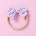 Detail of lilac jacquard bow headband with white dot texture on soft elastic nylon band - Light Purple