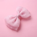 Detail view of pink mesh bow hair clip with textured polka dots for children - Light Pink