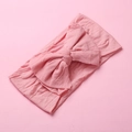 Detail of soft pink nylon baby headband with large double-layered bow and elastic texture - Deep Pink
