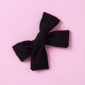 Detailed view of black textured cotton jacquard bow hair clip with 3D dotted pattern - Black
