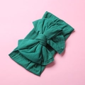Detailed texture of forest green nylon baby headband with a large double-layered bow - Dark Green