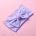 Close-up of soft lavender nylon headband with a large double-layered bow for babies - Purple