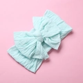 Detail of soft mint green nylon baby headband featuring a large double-layered bow knot - Sky Blue