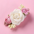 Detail of floral hair clip featuring realistic white and pink roses with soft fabric texture - White Pink Rose Mix Style