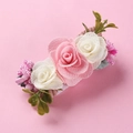 Close-up of three 3D simulation roses on a pink hair clip with green leaves and berries - Pink White Simulation Rose (2)