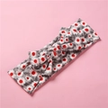 Gros plan du bandeau bébé en coton doux à imprimé fleuri avec détail de nœud - Tournesol Gris Rouge