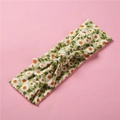 Détail du bandeau bébé en coton à fleurs avec imprimé marguerites et design noué - Floral Tournesol Vert
