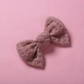 Close-up of pink knitted bow hair clip showing textured plaid yarn and woven details - 10*6 cm / Lotus root pink