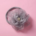 Macro detail of a grey chiffon flower headband with white stamens and soft elastic band - Gray