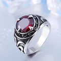 Vintage stainless steel ring for men featuring a large round red gemstone and scroll engravings - US Size 7 / Red Rhinestone