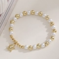 Chic beach style pearl and gold bead bracelet featuring a detailed turtle pendant - Turtle Charm Style (32351)