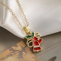 Weihnachtliche Goldkette mit roten Emaille-Glocken und Stechpalmenblättern auf Seide - Glocken Schleife Stil