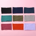 Macro view of nine soft nylon headbands in various colors for babies and girls - Random Color