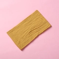 Detail view of mustard yellow stretch nylon headband with ribbed texture for kids - Ginger Yellow