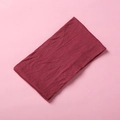Detail shot of the soft knitted texture and burgundy nylon fabric of this baby headband - Burgundy