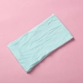 Detail shot of the mint green soft nylon headband showing textured knitted fabric - Sky Blue