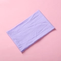 Detail view of purple soft nylon baby headband with stretchable ribbed knitted texture - Purple