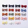 Flat lay of colorful waffle knit bow hair clips in 19 different winter colors - Mixed Styles Bows / Random Mixed Colors