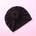 Detailed top view of black waffle knit baby turban hat with a cute donut knot decoration - Black