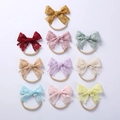 Detailed close-up of 10-piece baby nylon headbands with floral lace embroidery bows - 10*7CM / Random Mix