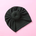 Detailed waffle knit texture and doughnut knot design on a dark gray baby turban hat - Dark Green