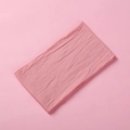 Close-up of pink knitted baby headband showing soft woven texture on flat surface - Deep Pink