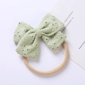 Dettaglio fascia per neonati con fiocco ricamato verde chiaro ed elastico in nylon - 7.5*5.5 cm / Verde Scuro