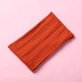 Detailed knit texture of a warm orange winter neck warmer on a pink background - 15.5*8.5cm / Orange Red