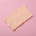 Detail view of ultra-soft light beige nylon fabric texture for baby headband - Light Orange