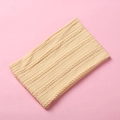 Close-up of beige jacquard knit baby headband with soft cable pattern texture - 15.5*8.5cm / Light Yellow