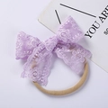 Close-up of soft purple floral lace embroidery bow on an elastic baby headband - 10*7CM / Purple