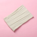 Detailed cable knit texture of a soft cream baby headband on a pink background - 15.5*8.5cm / Off-White