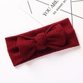 Dettaglio ravvicinato della trama jacquard bordeaux sulla fascia elastica per neonati - 17x7cm / Rosso Scuro