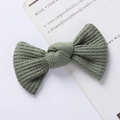Detailed close-up of sage green waffle knit bow hair clip with ribbed texture on card - Ribbed Texture Bow / Sage Green
